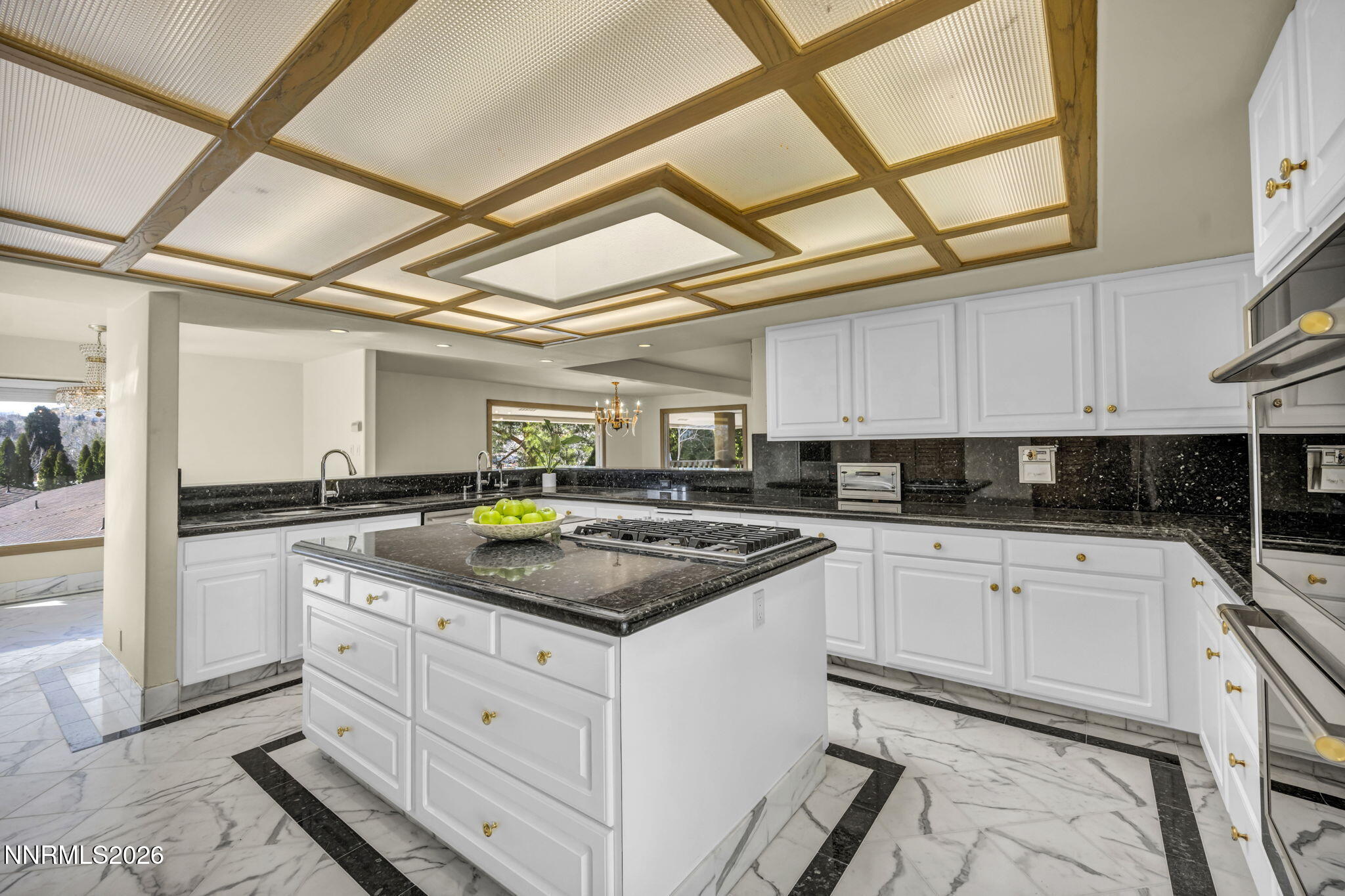 2570 Spinnaker Drive Reno, NV 89519 - Photo 12 of 41 a kitchen with stainless steel appliances granite countertop a sink and cabinets