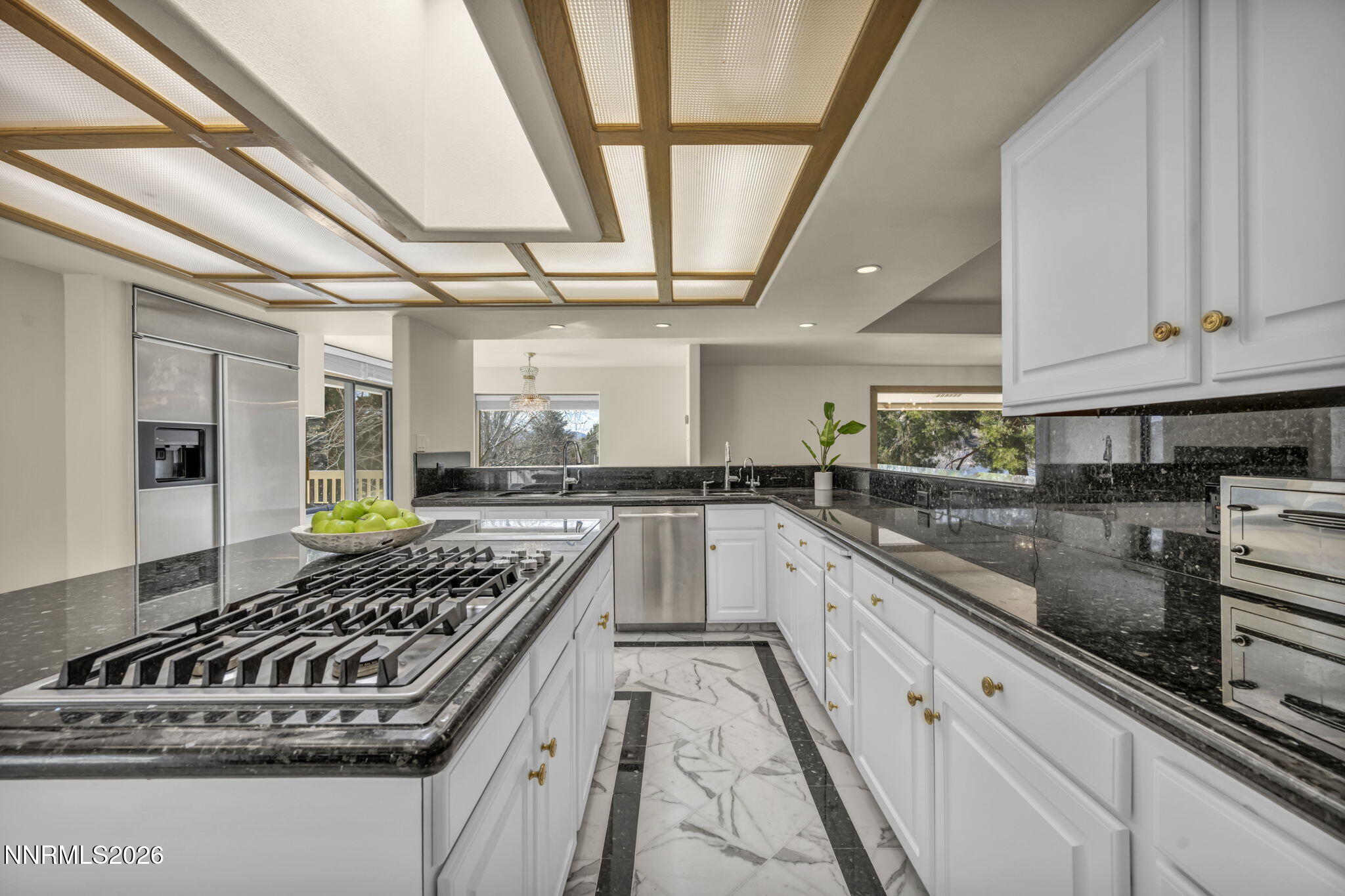2570 Spinnaker Drive Reno, NV 89519 - Photo 13 of 41 a kitchen with stainless steel appliances granite countertop a stove and a sink