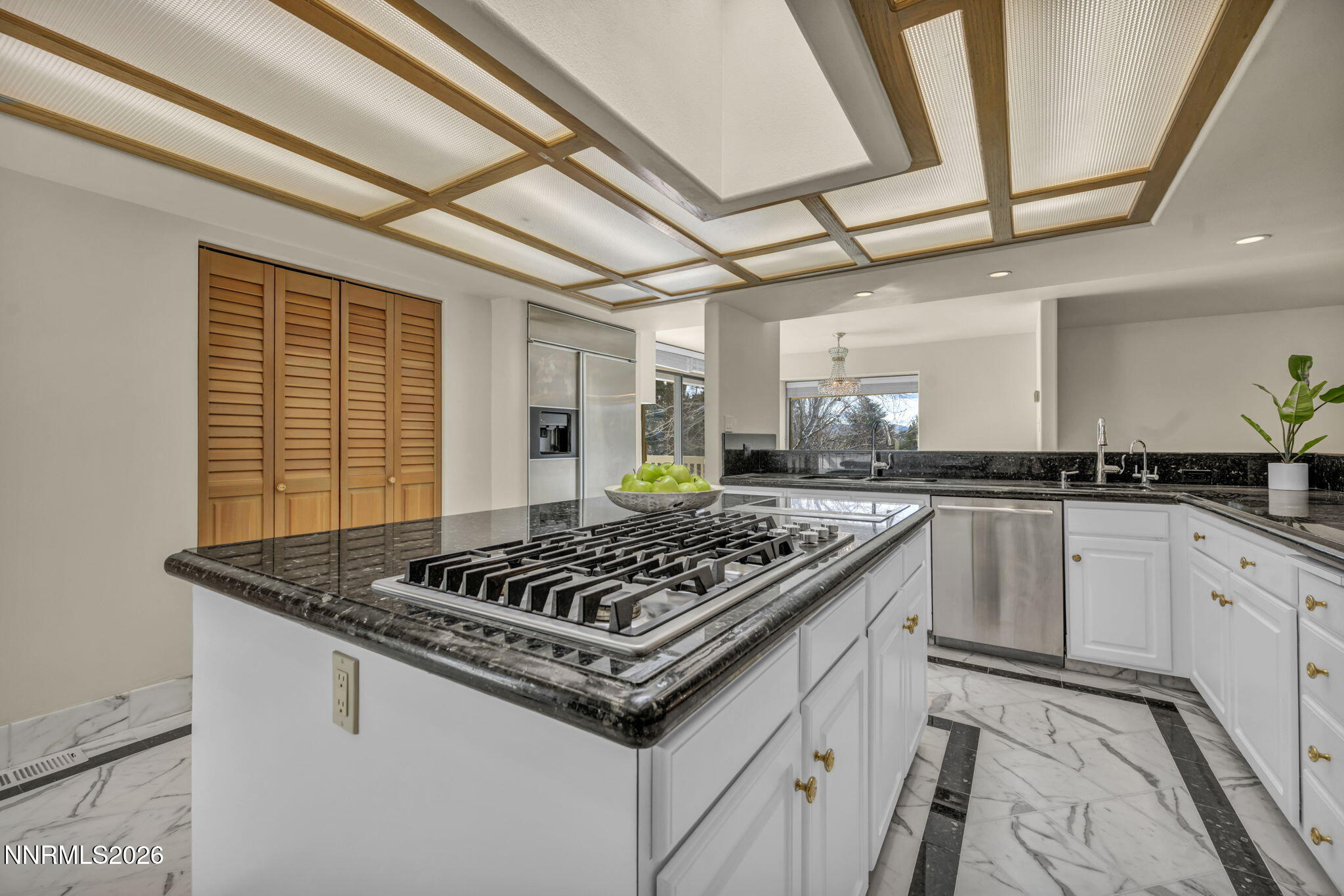 2570 Spinnaker Drive Reno, NV 89519 - Photo 14 of 41 a kitchen with stainless steel appliances granite countertop a stove sink and cabinets