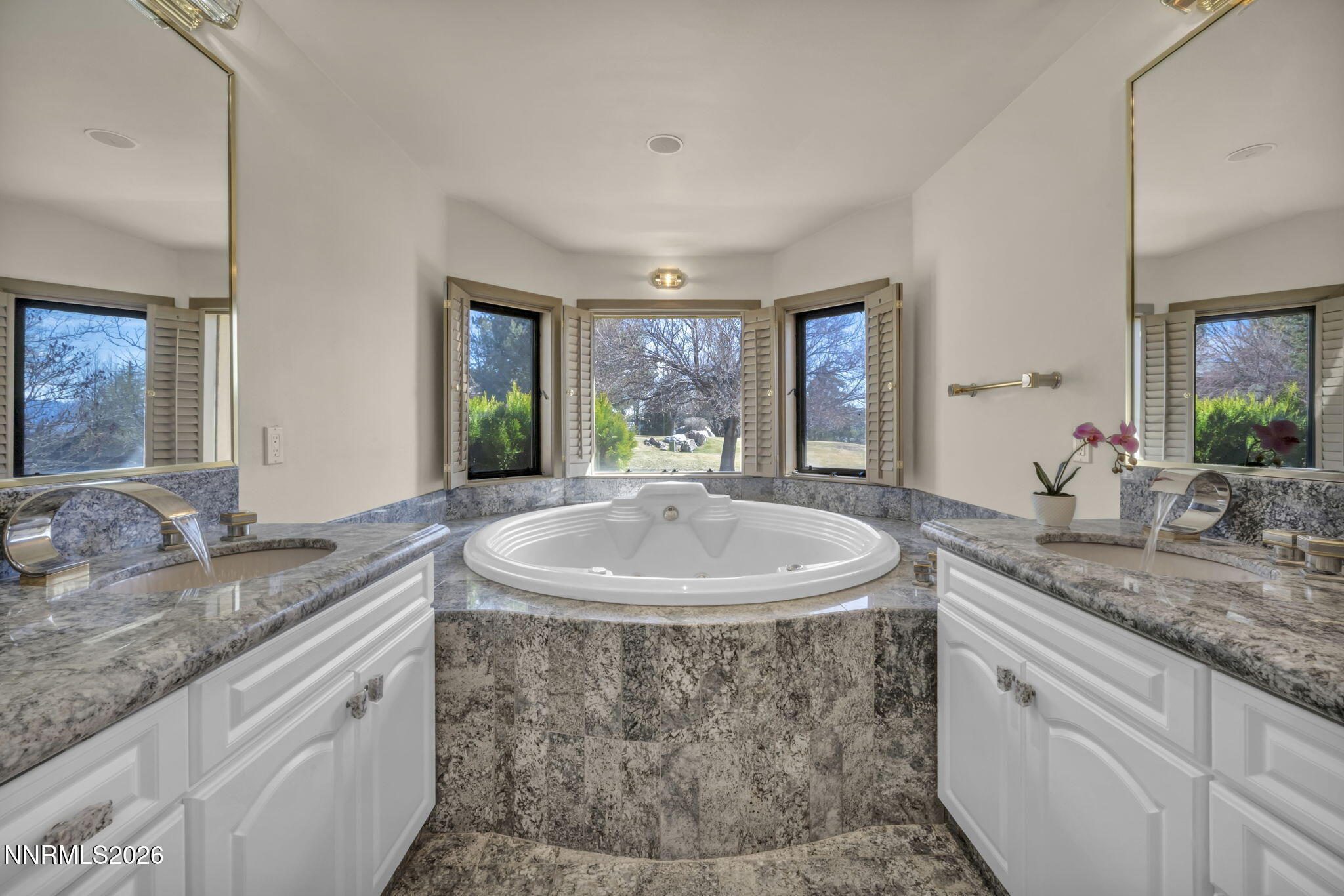 2570 Spinnaker Drive Reno, NV 89519 - Photo 21 of 41 a bathroom with a granite countertop sink and a mirror