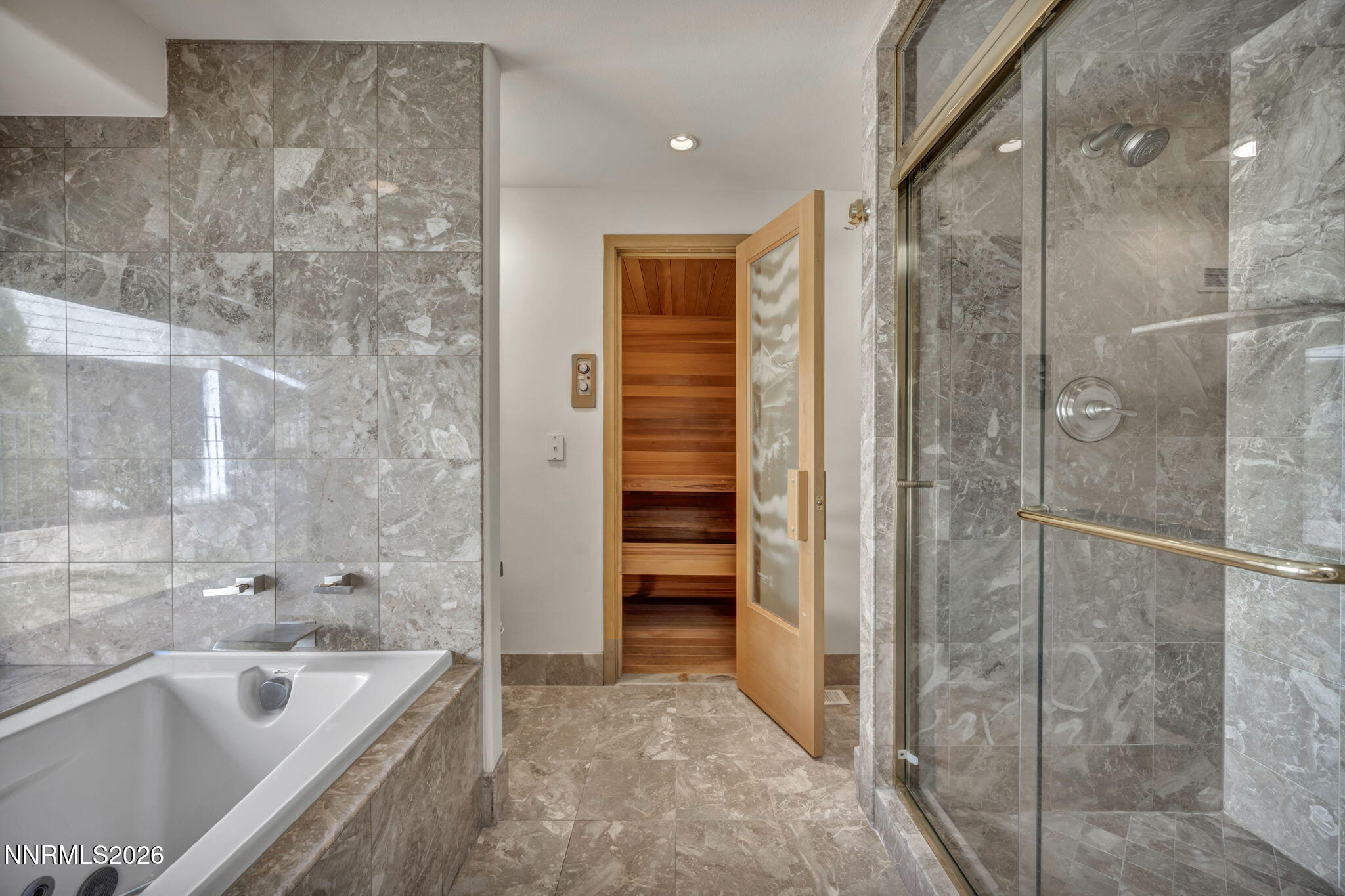 2570 Spinnaker Drive Reno, NV 89519 - Photo 22 of 41 a bathroom with a bathtub and a shower