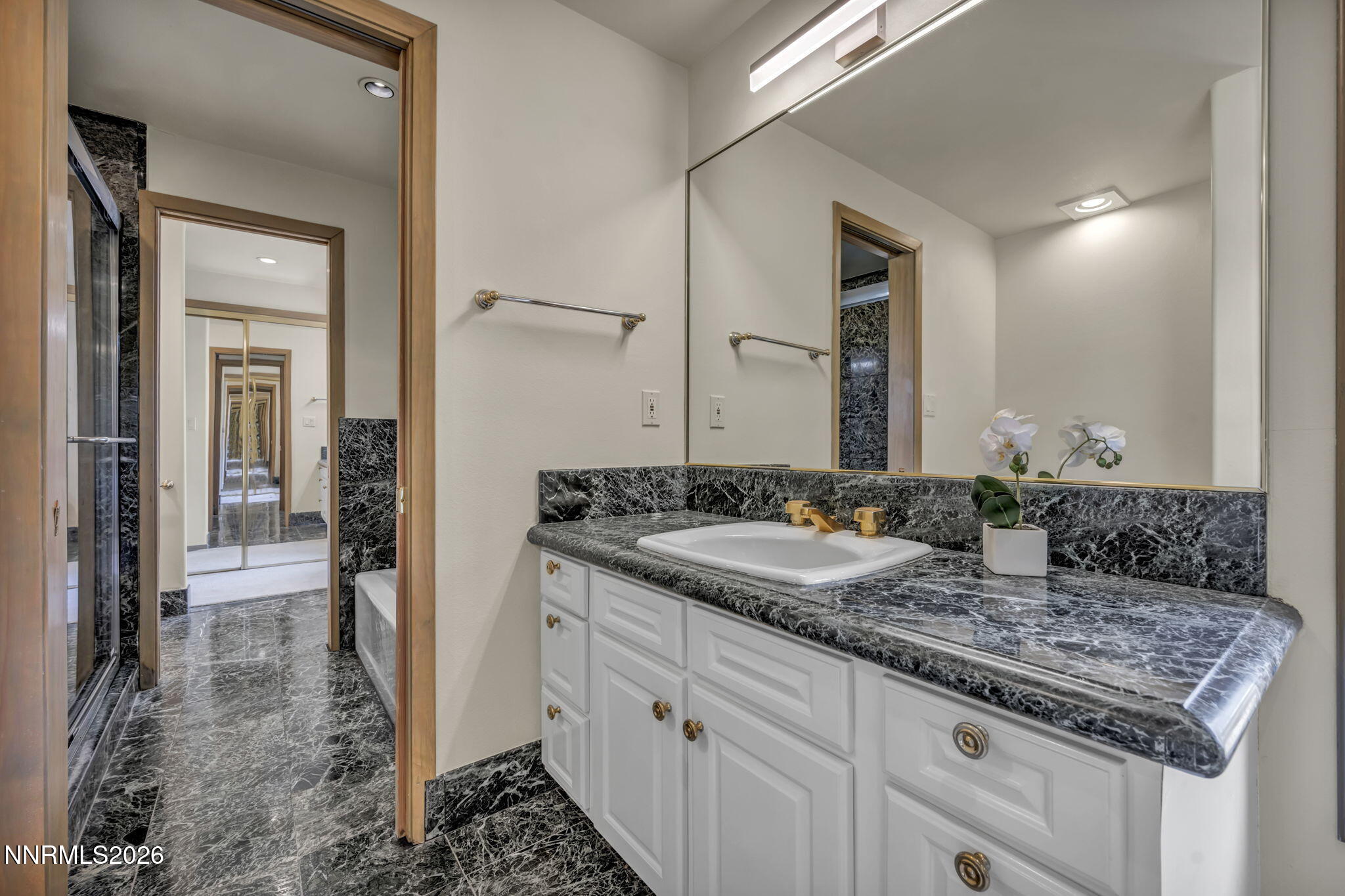 2570 Spinnaker Drive Reno, NV 89519 - Photo 25 of 41 a bathroom with a granite countertop sink and a mirror