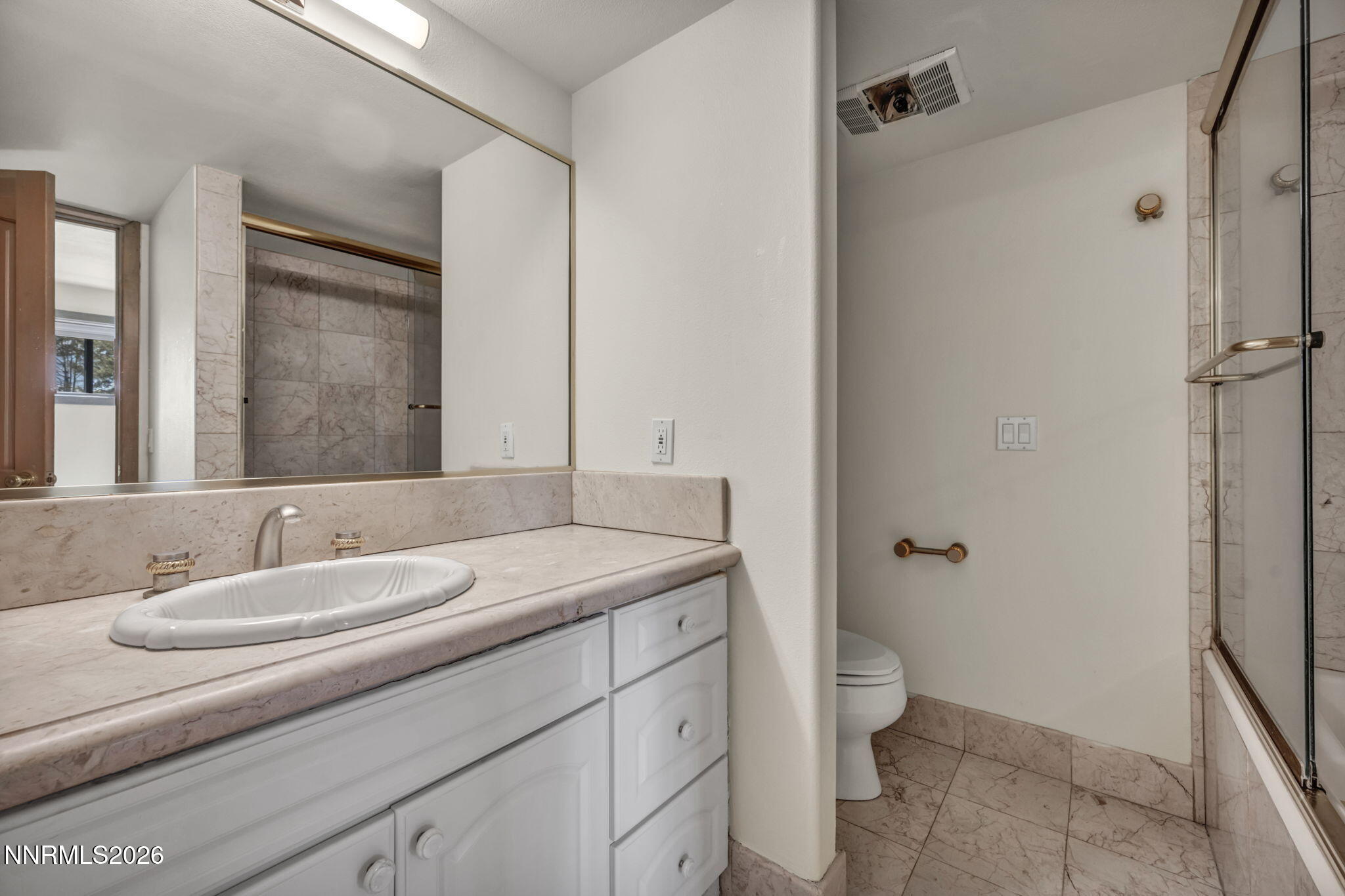 2570 Spinnaker Drive Reno, NV 89519 - Photo 27 of 41 a bathroom with a granite countertop sink toilet and shower