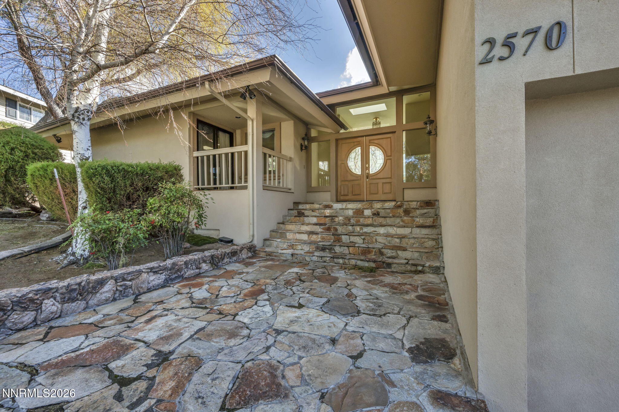 2570 Spinnaker Drive Reno, NV 89519 - Photo 28 of 41 a front view of a house with a yard