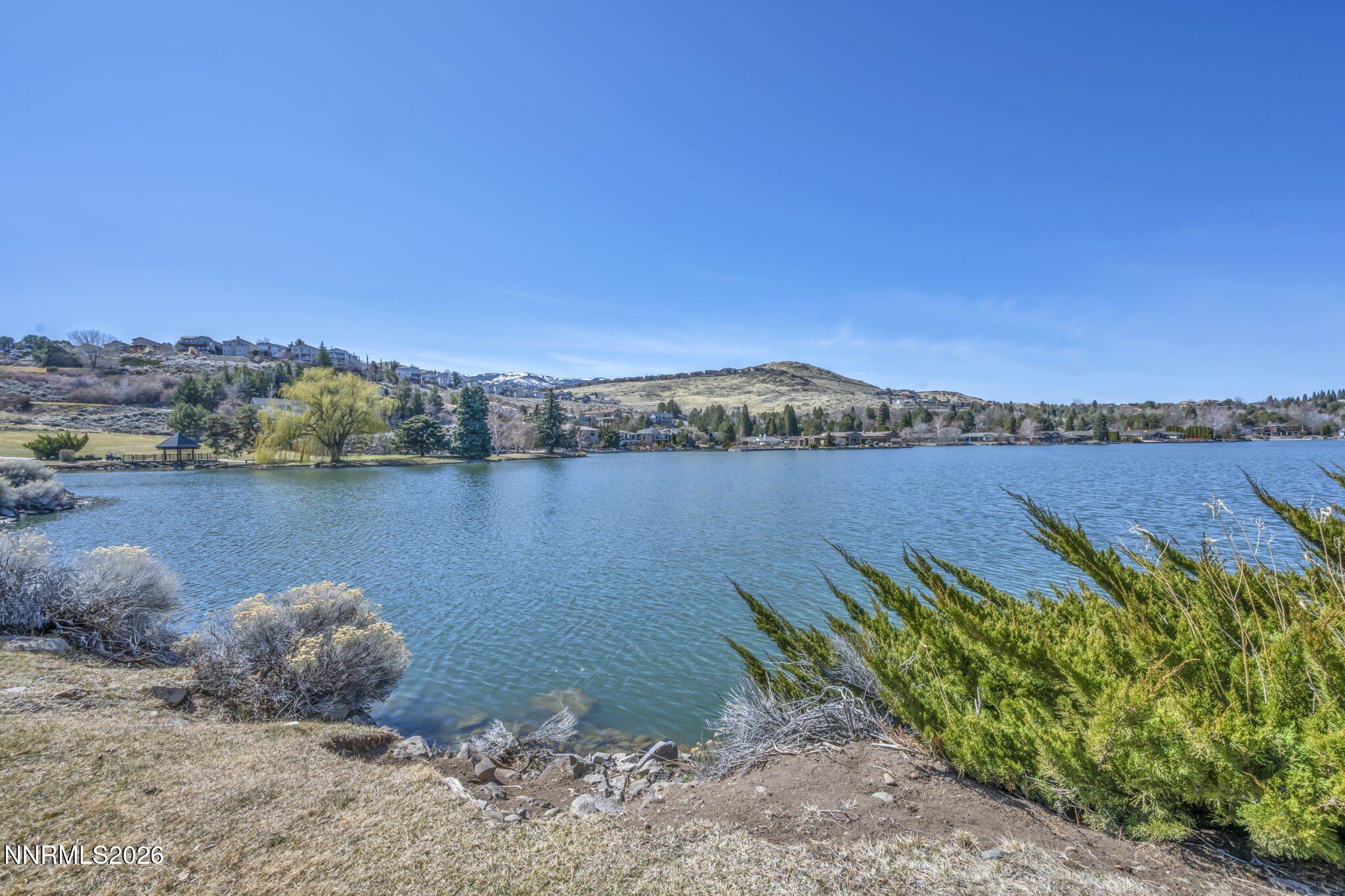 2570 Spinnaker Drive Reno, NV 89519 - Photo 38 of 41 a view of a lake with a mountain in the background