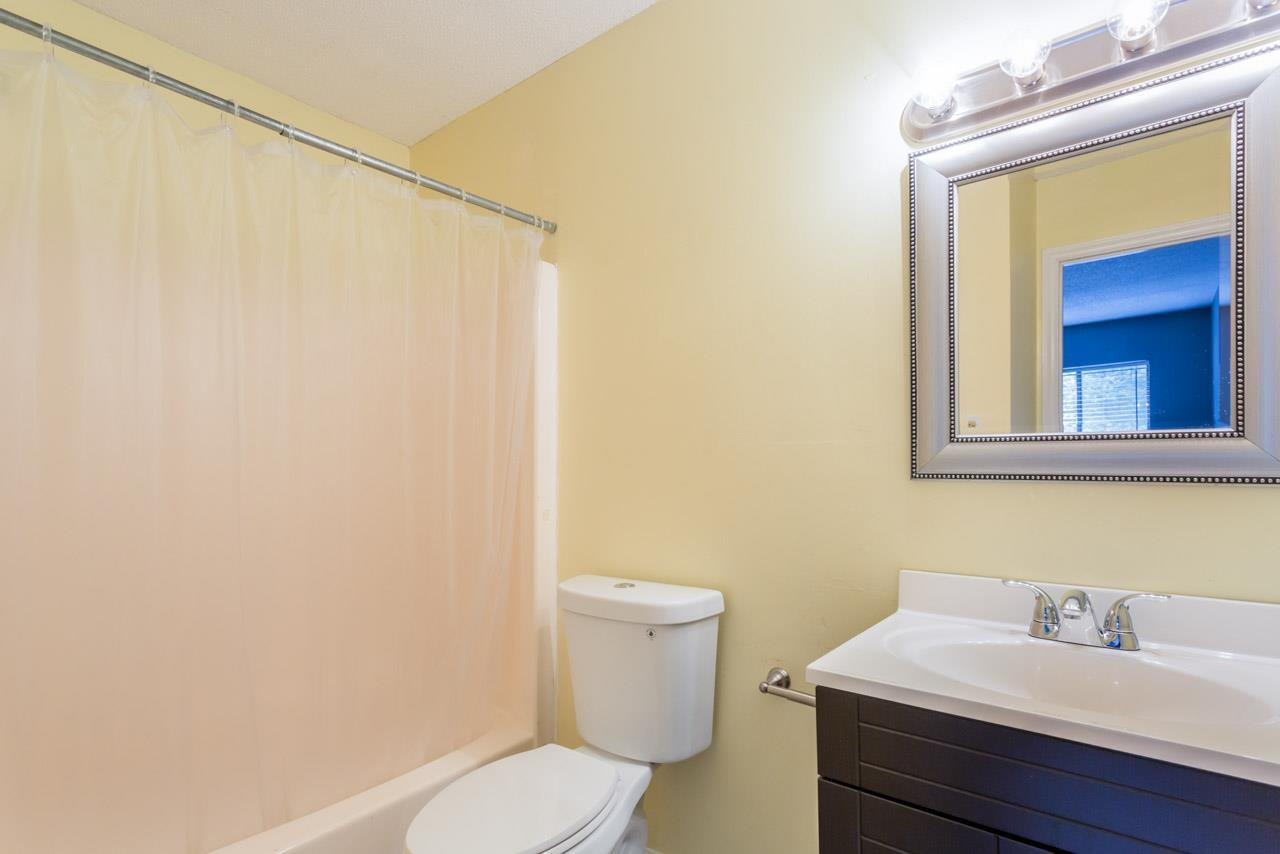 5036 Flint Ridge Place, Unit 5036 Raleigh, NC 27609 - Photo 11 of 18 a bathroom with a sink a toilet and mirror