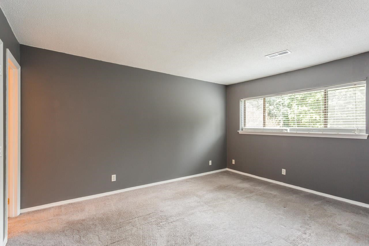 5036 Flint Ridge Place, Unit 5036 Raleigh, NC 27609 - Photo 9 of 18 a view of an empty room with a window
