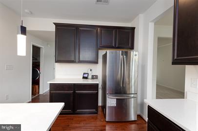 122 Blakely Road Kearneysville, WV 25430 - Photo 11 of 26 a kitchen with stainless steel appliances a refrigerator and wooden cabinets
