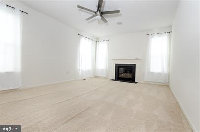 122 Blakely Road Kearneysville, WV 25430 - Photo 2 of 26 an empty room with fireplace and windows