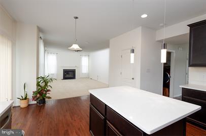 122 Blakely Road Kearneysville, WV 25430 - Photo 9 of 26 a large kitchen with sink a refrigerator and wooden floor