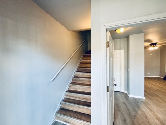 6631 South Justine Street Chicago, IL 60636 - Photo 2 of 18 a view of a hallway with wooden floor and entryway