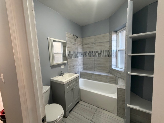 6631 South Justine Street Chicago, IL 60636 - Photo 4 of 18 a bathroom with a sink toilet and shower