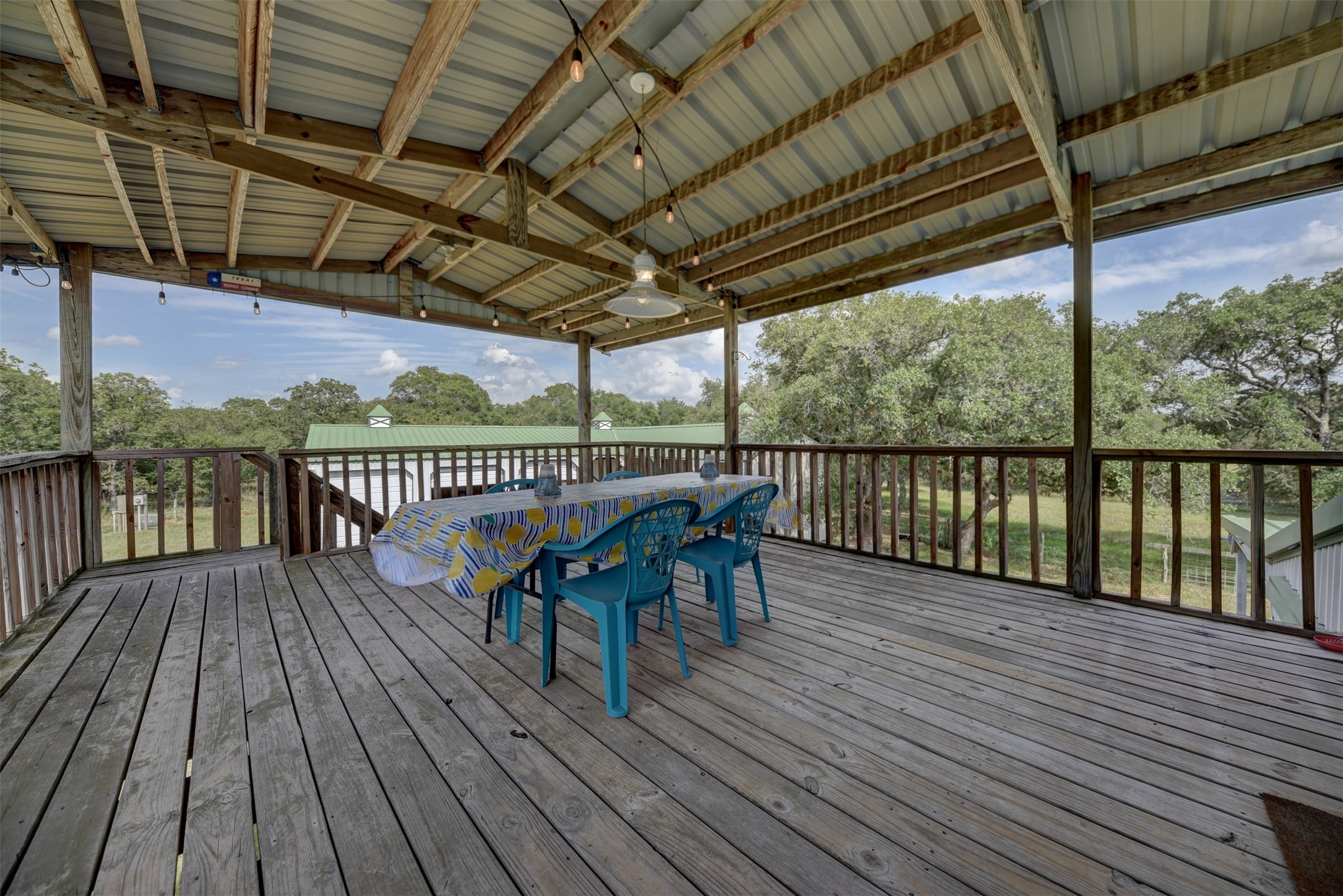 2003 Oak Ridge Road Weimar, TX 78962 - Photo 23 of 35 a view of a roof deck with wooden floor