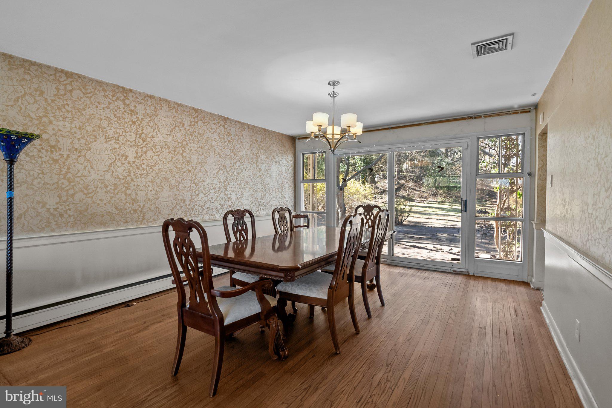 326 Hidden River Road Penn Valley, PA 19072 - Photo 11 of 56 a view of a dining room with furniture and wooden floor