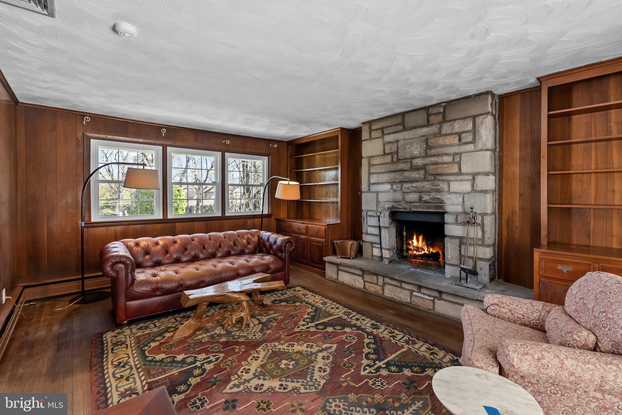326 Hidden River Road Penn Valley, PA 19072 - Photo 13 of 56 a living room with furniture and a fireplace