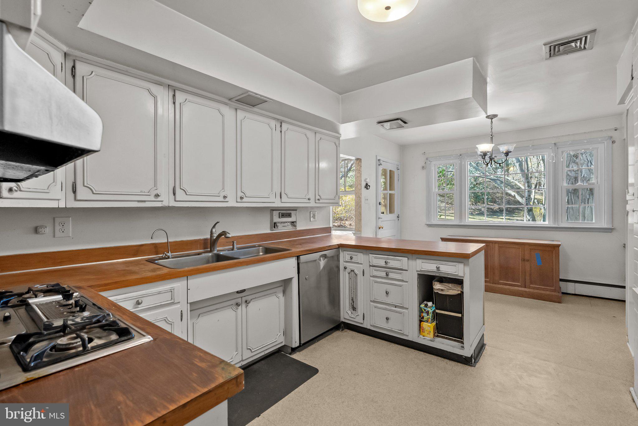 326 Hidden River Road Penn Valley, PA 19072 - Photo 15 of 56 a kitchen that has a sink and a stove