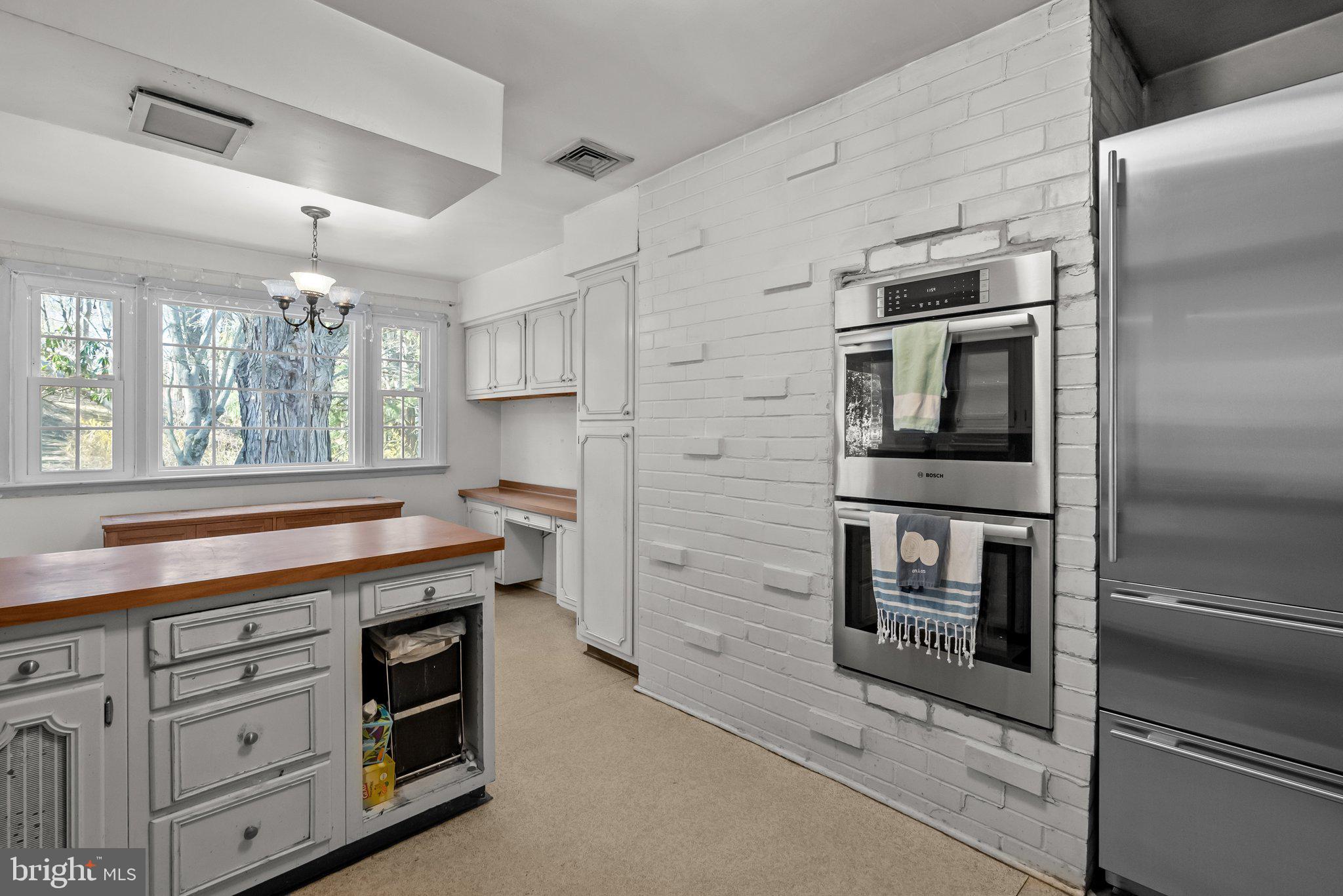 326 Hidden River Road Penn Valley, PA 19072 - Photo 16 of 56 a kitchen with cabinets and appliances