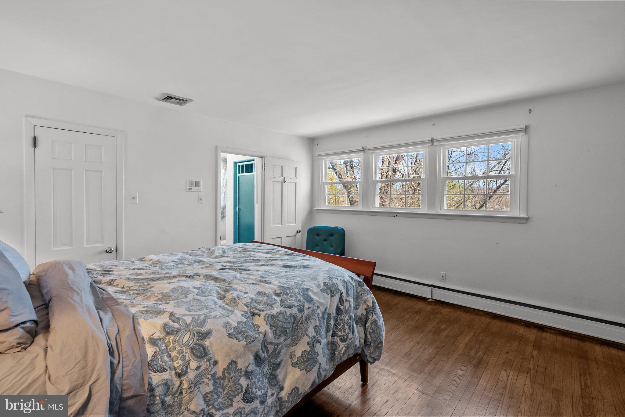 326 Hidden River Road Penn Valley, PA 19072 - Photo 21 of 56 a bedroom with a bed and a window