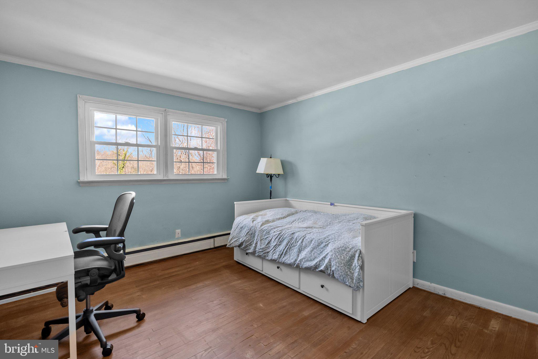 326 Hidden River Road Penn Valley, PA 19072 - Photo 23 of 56 a bedroom with a bed a desk and chair