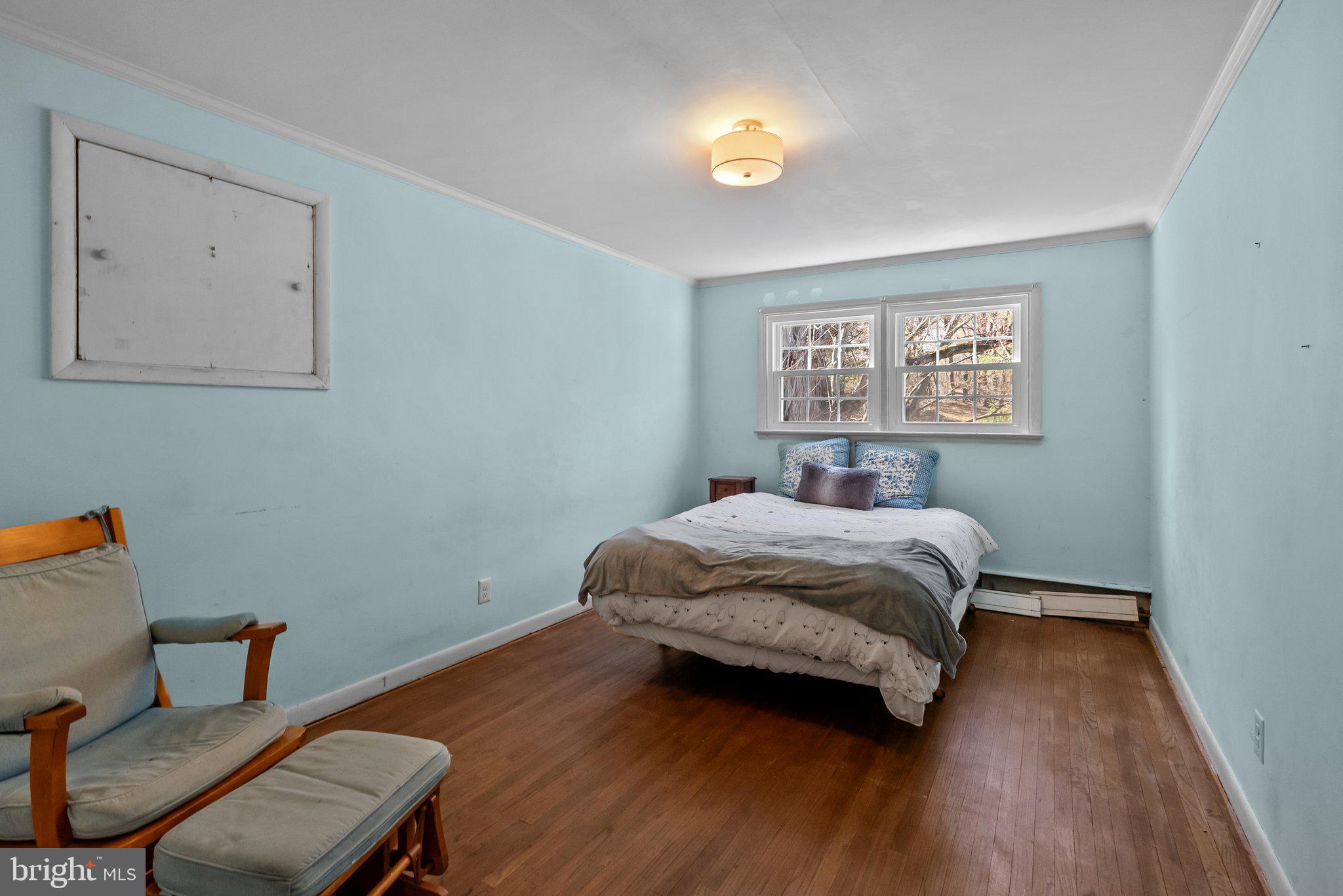 326 Hidden River Road Penn Valley, PA 19072 - Photo 25 of 56 a bedroom with a bed and a desk