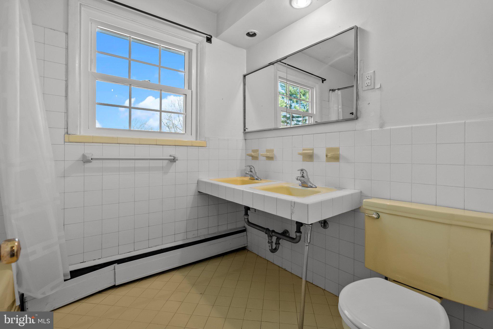 326 Hidden River Road Penn Valley, PA 19072 - Photo 27 of 56 a bathroom with a sink toilet and mirror