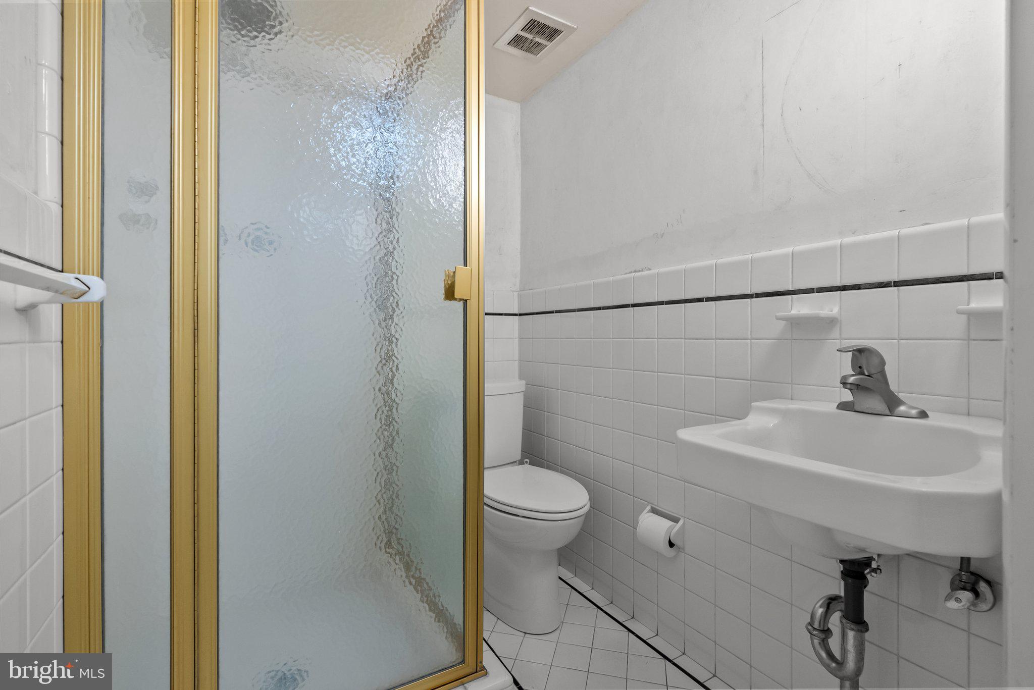 326 Hidden River Road Penn Valley, PA 19072 - Photo 31 of 56 a bathroom with a sink toilet and a mirror