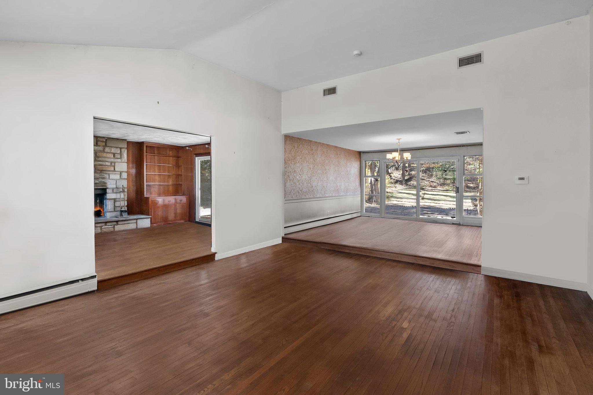 326 Hidden River Road Penn Valley, PA 19072 - Photo 6 of 56 wooden floor in an empty room with a window