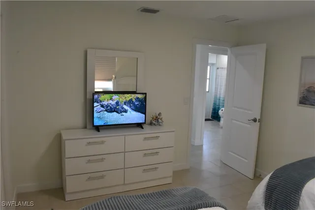 a view of hallway with window and furniture