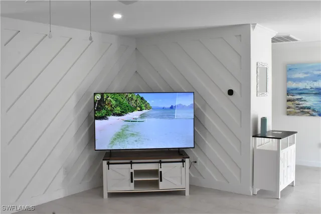 a room with a table and a fireplace