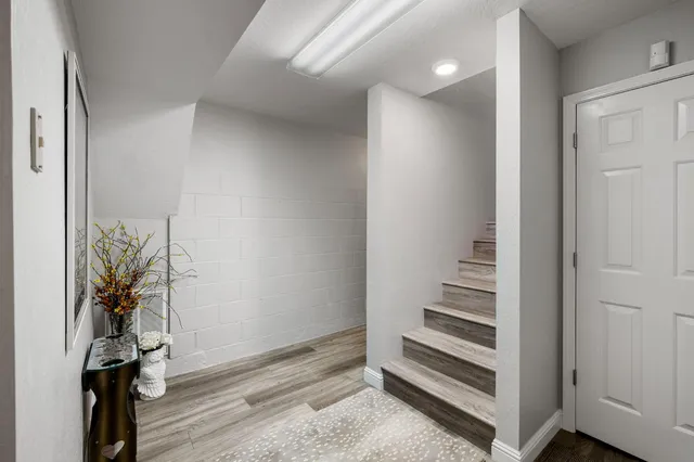 a view of an entryway with wooden floor
