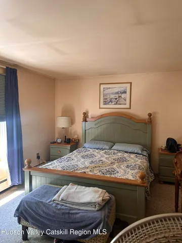 a living room with a couch and wooden floor