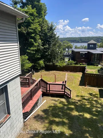 a view of a swimming pool with seating space