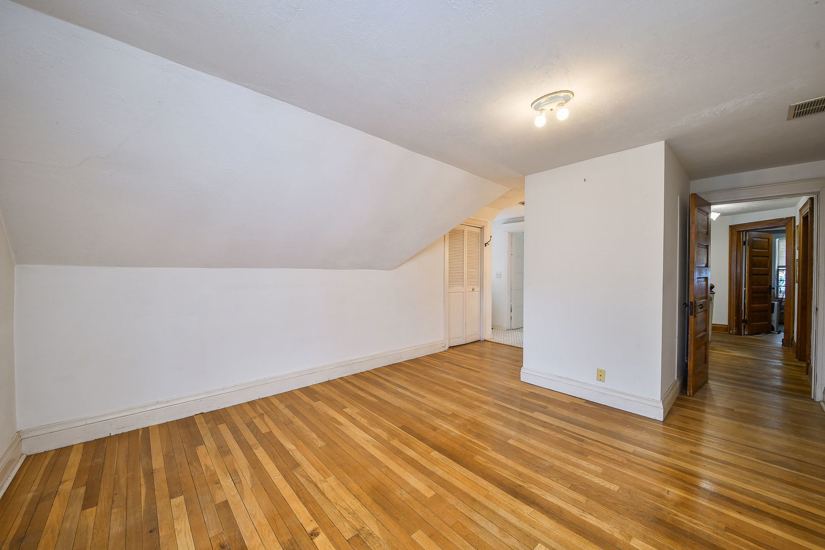 116 South Wright Street Naperville, IL 60540 - Photo 23 of 49 a view of an empty room with wooden floor