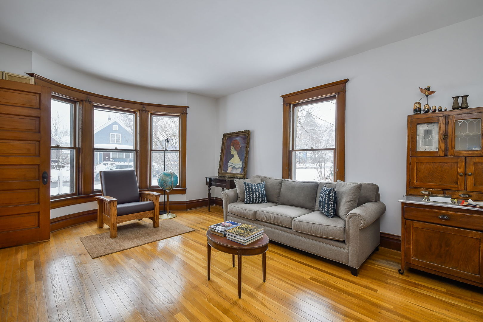 116 South Wright Street Naperville, IL 60540 - Photo 9 of 49 a living room with furniture flat screen tv and a large window