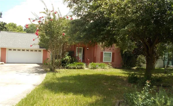 a backyard of a house with yard and outdoor seating
