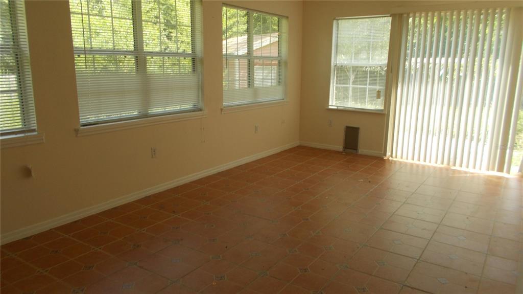 3525 Northwest 86 Way Gainesville, FL 32606 - Photo 7 of 7 an empty room with a window
