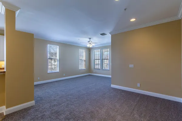 a view of an empty room with a cabinet
