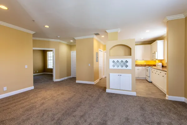 a kitchen with granite countertop cabinets stainless steel appliances and a sink