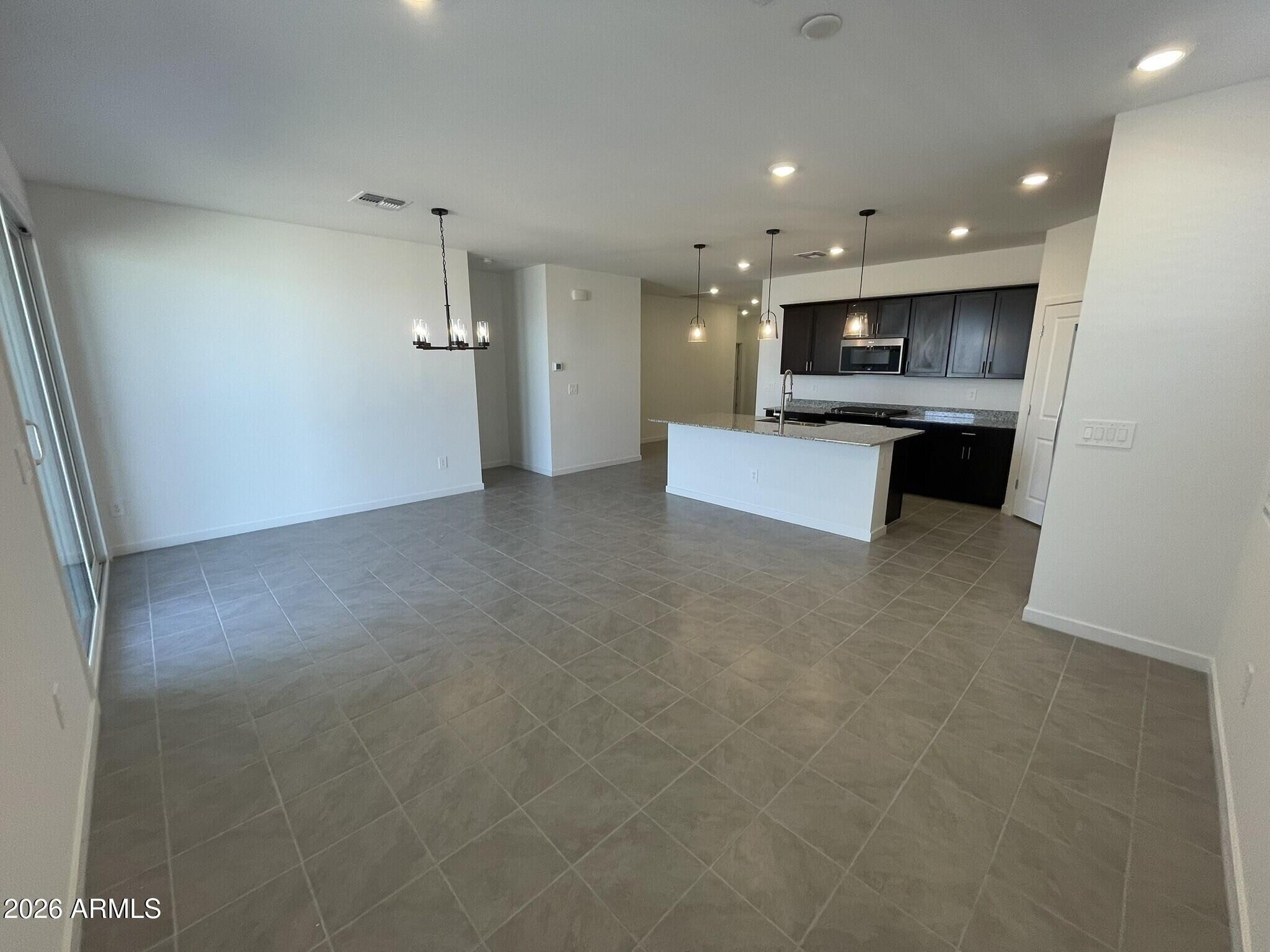 37014 West Prado Street Maricopa, AZ 85138 - Photo 12 of 18 a view of kitchen with refrigerator sink and stove