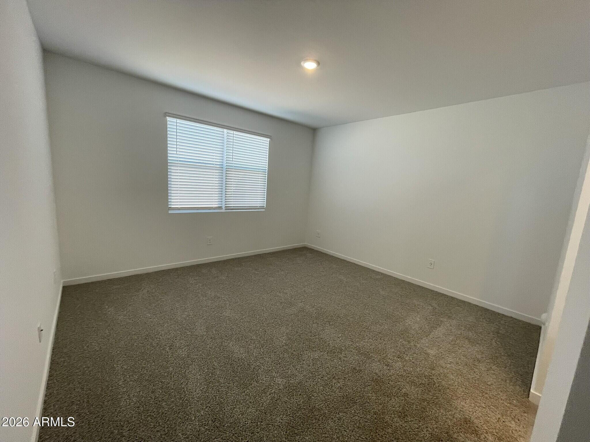 37014 West Prado Street Maricopa, AZ 85138 - Photo 14 of 18 an empty room with a window