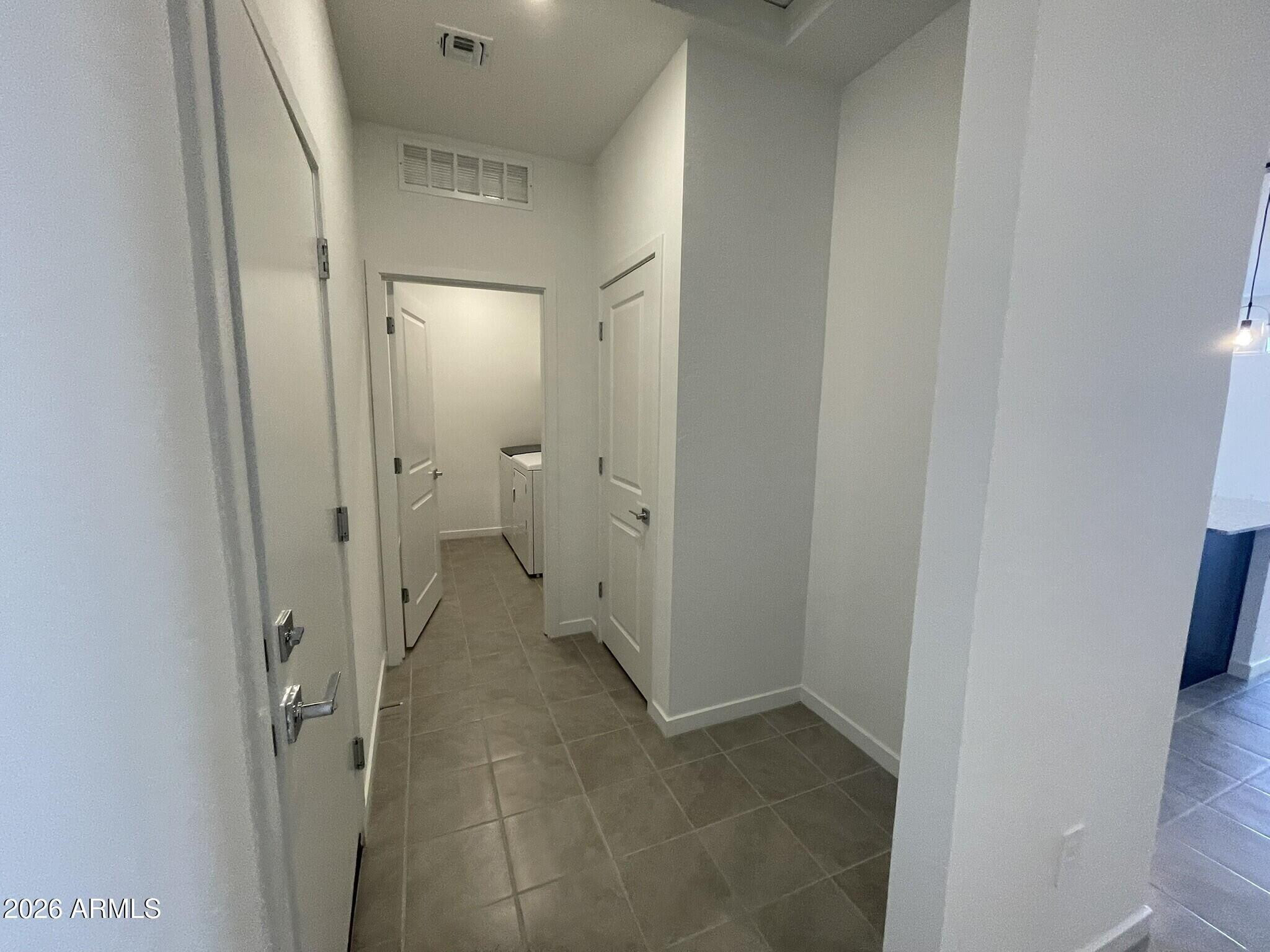 37014 West Prado Street Maricopa, AZ 85138 - Photo 2 of 18 a view of a bathroom from a hallway
