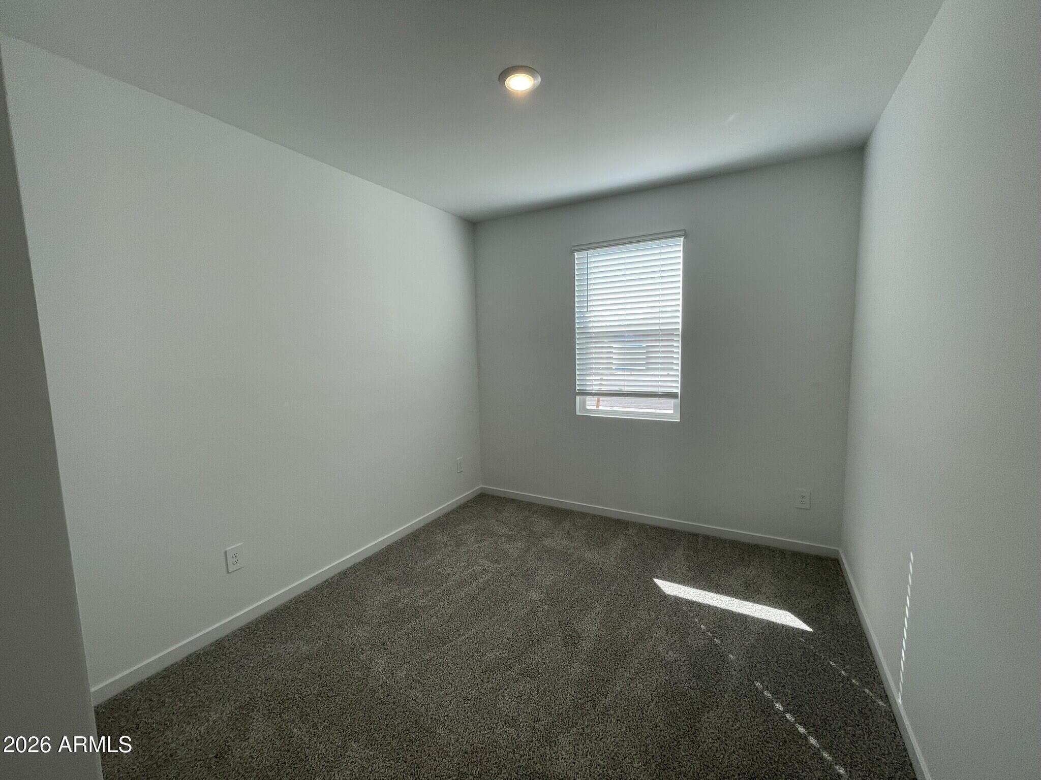 37014 West Prado Street Maricopa, AZ 85138 - Photo 5 of 18 an empty room with a window