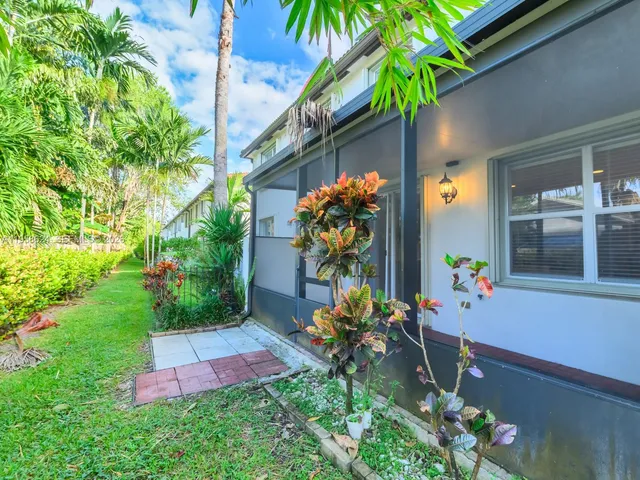 a front view of a house with yard