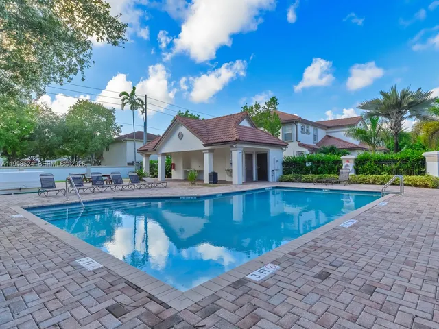 a view of a house with swimming pool