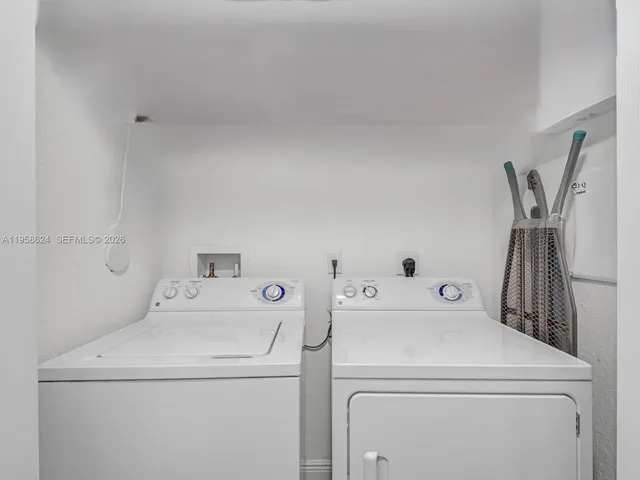 a kitchen with stainless steel appliances granite countertop a refrigerator stove a sink and dishwasher