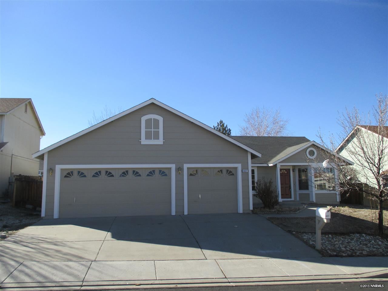 a front view of a house with garage