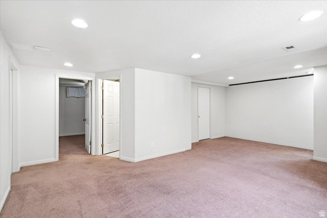 1341 29th Street Ogden, UT 84403 - Photo 26 of 37 Spacious room featuring neutral carpeting, recessed lighting, and white walls