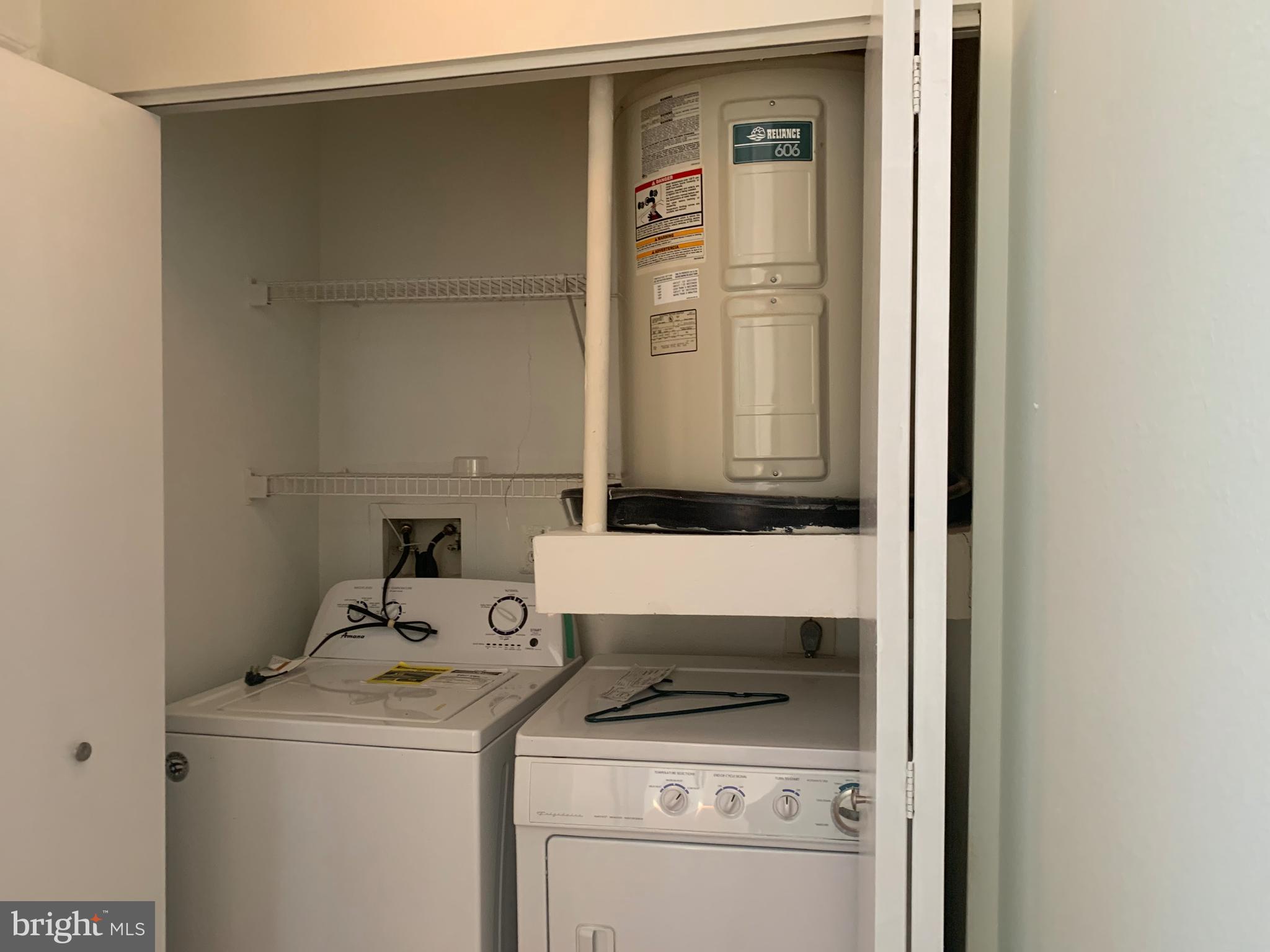 18533 Boysenberry Drive, Unit 288212 Gaithersburg, MD 20879 - Photo 14 of 17 a utility room with dryer and washer