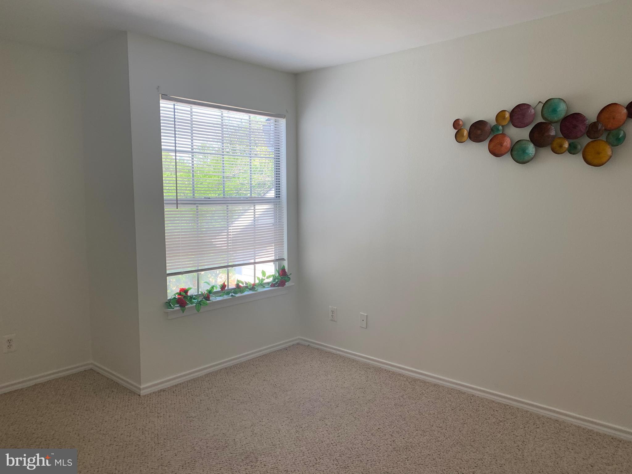 18533 Boysenberry Drive, Unit 288212 Gaithersburg, MD 20879 - Photo 7 of 17 an empty room with window