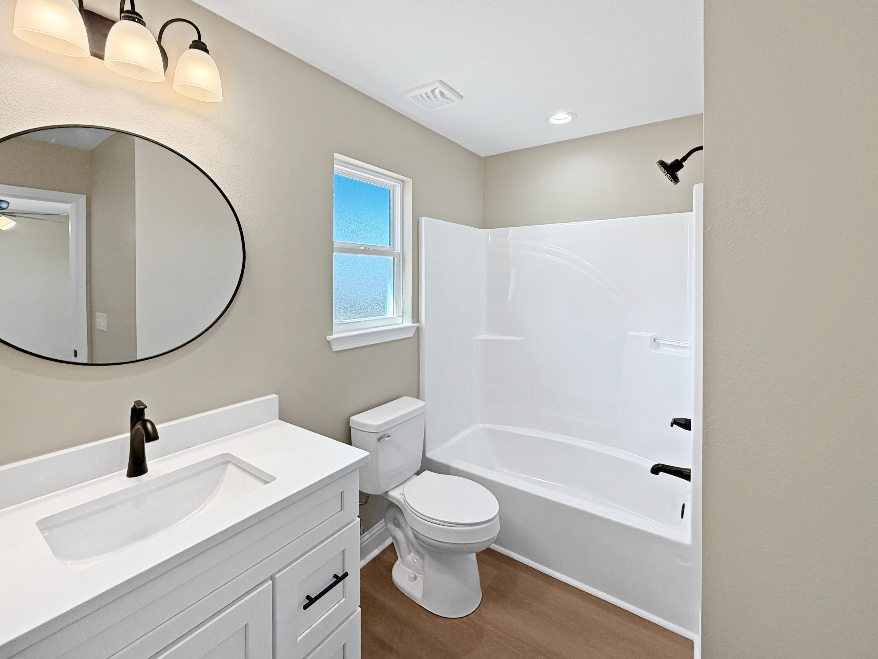 5356 Highview Drive Crestview, FL 32539 - Photo 15 of 18 a bathroom with a sink a toilet and a mirror